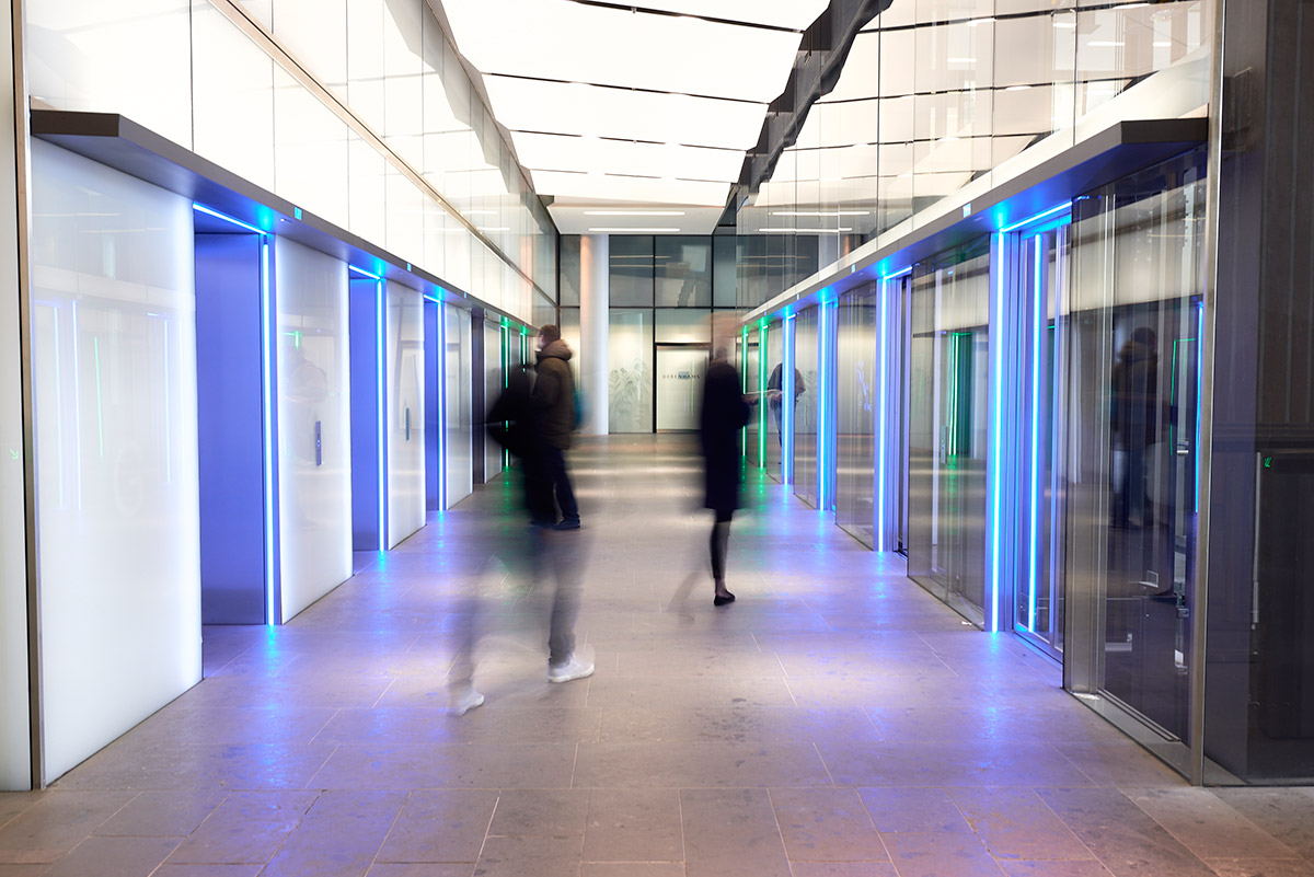 People rushing in front of elevator